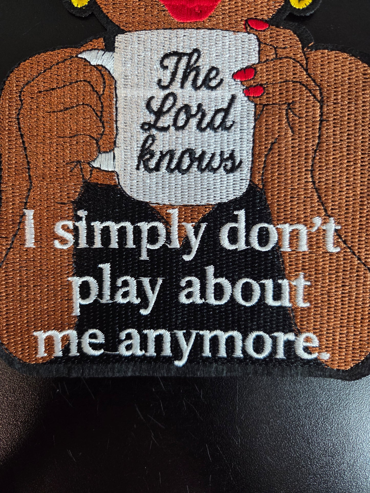 Winking Betty - The Lord Knows Iron On Patch